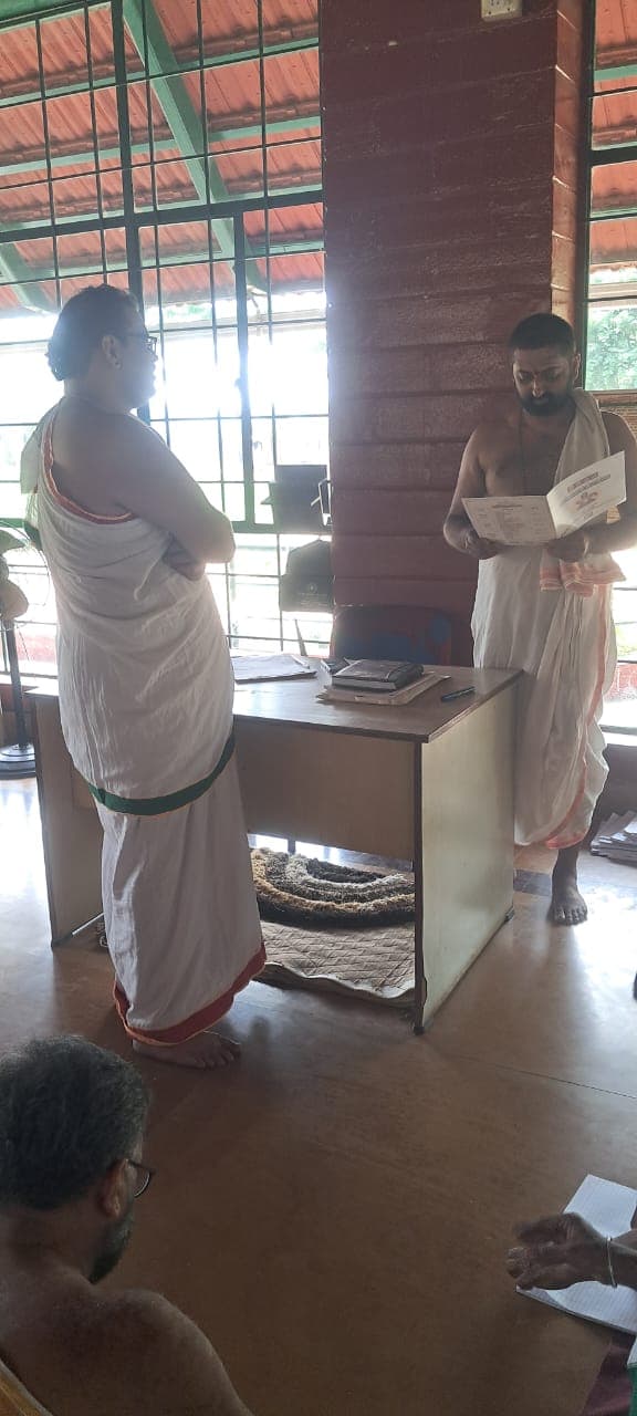 Adhyāpaka reviewing a manuscript with a student at Varthur Gurukula